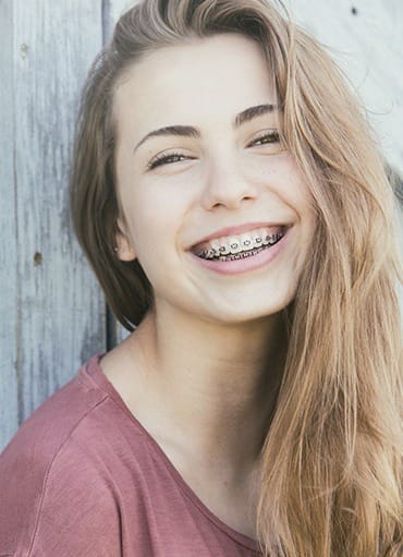 Smiling teen girl with braces