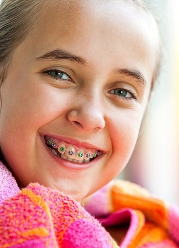 Girl in colorful scarf with traditional braces in Glenpool