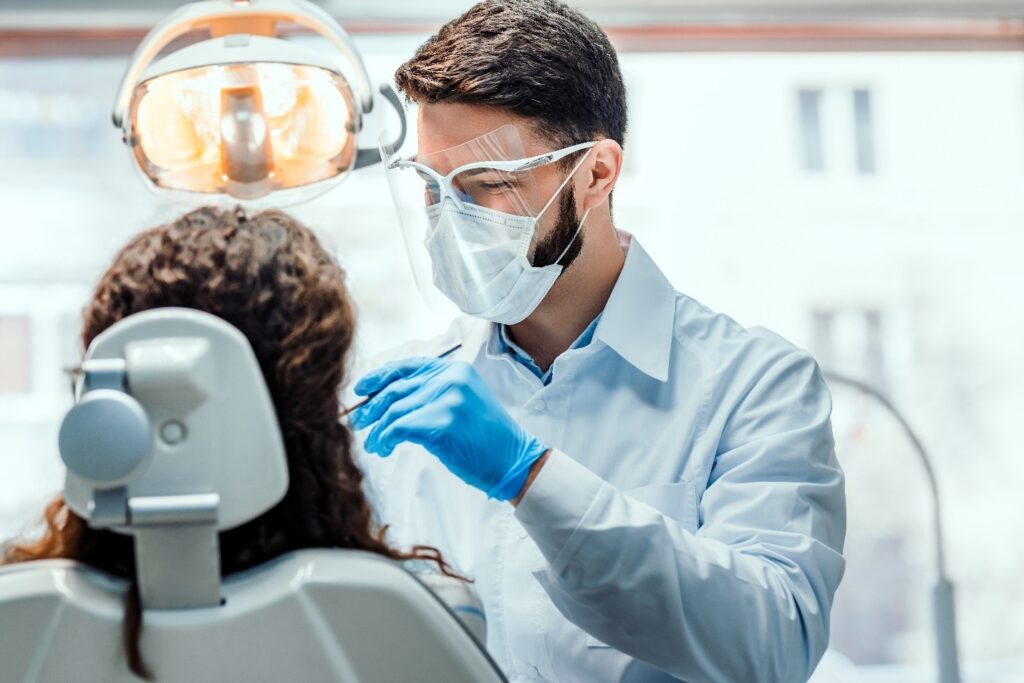 dentist performing braces removal